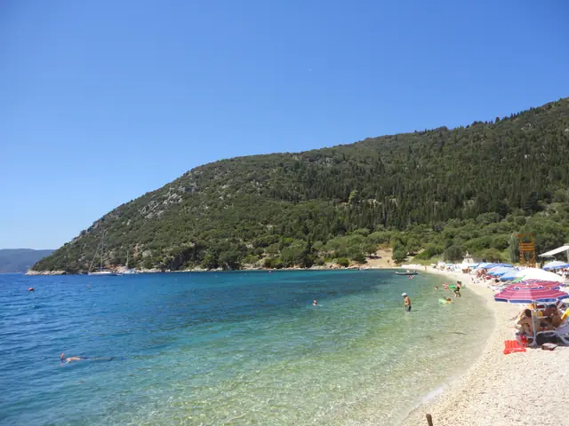 Avithos Beach in Kefalonia, featuring a sandy shoreline with calm water conditions