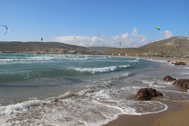 Prasonisi Beach in Rhodes, featuring a sandy shoreline with calm water conditions