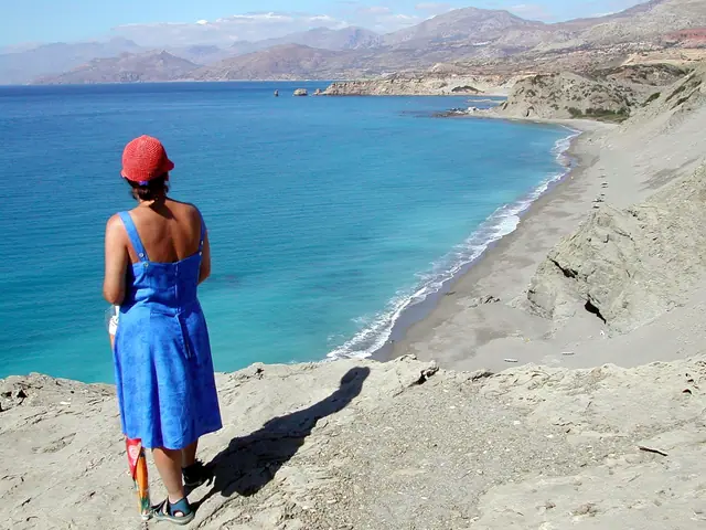 Triopetra Beach in Crete, featuring a sandy shoreline with moderate water conditions