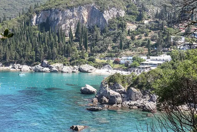 Liapades Beach in Corfu, featuring a pebbly shoreline with moderate water conditions