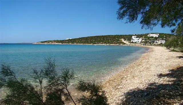 Aliki Beach in Paros, featuring a mixed shoreline with calm water conditions