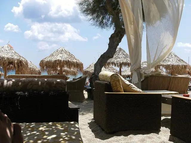 Paradise Beach in Mykonos, featuring a sandy shoreline with calm water conditions