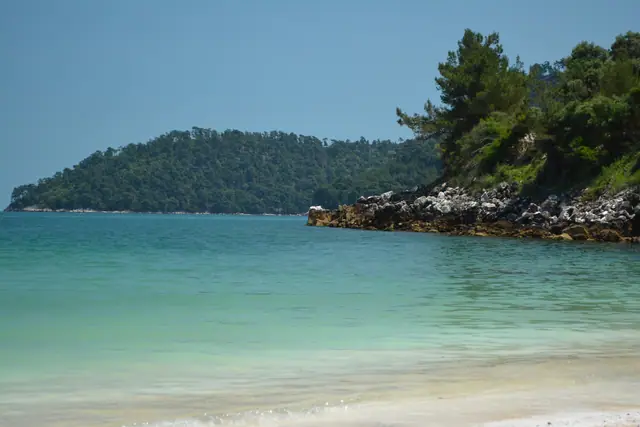 Saliara - Marble Beach in Thassos, featuring a pebbly shoreline with moderate water conditions