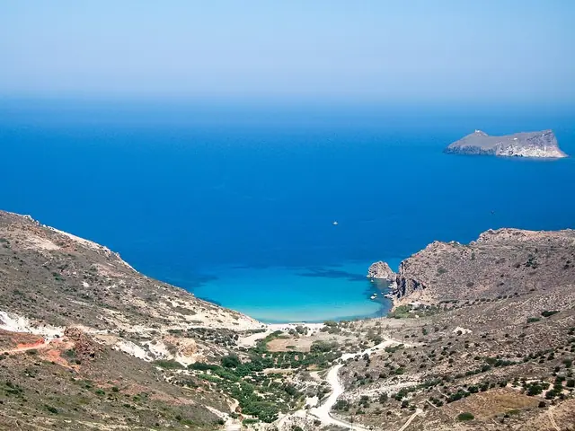 Plathiena Beach in Milos, featuring a mixed shoreline with moderate water conditions