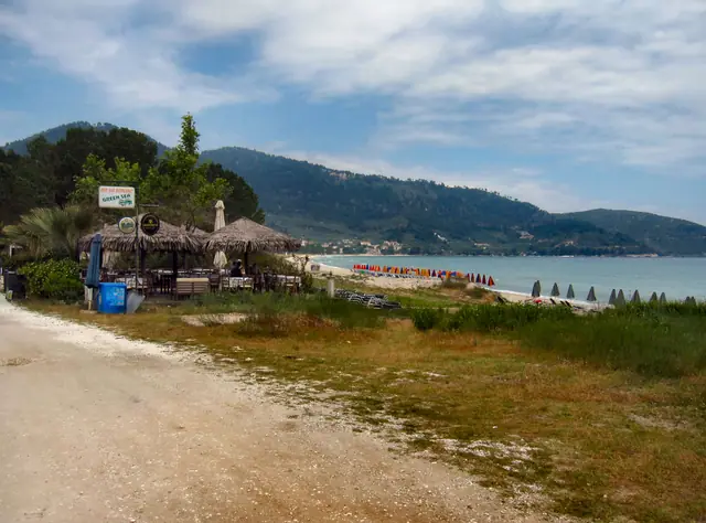 Chrysi Akti beach in Thassos, featuring a sandy shoreline with moderate water conditions