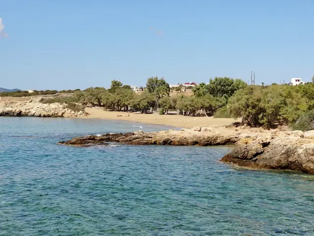 Faragas Beach in Paros, featuring a sandy shoreline with moderate water conditions