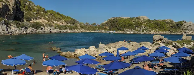 Ladiko Beach in Rhodes, featuring a mixed shoreline with moderate water conditions